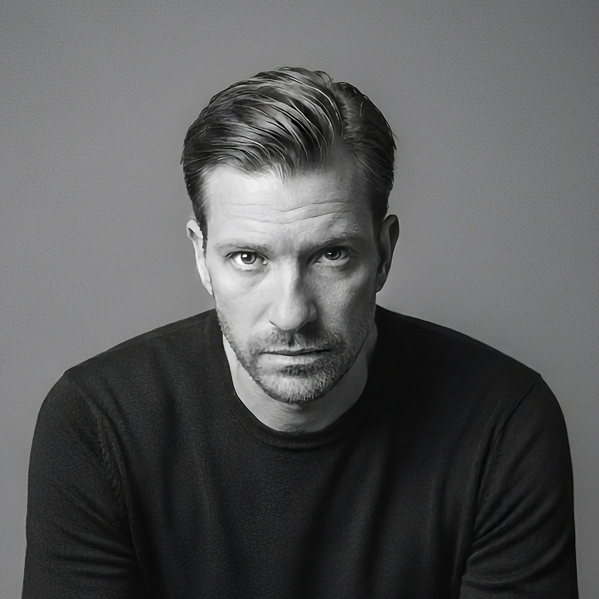 Jacob Top Møller seated in a black sweater