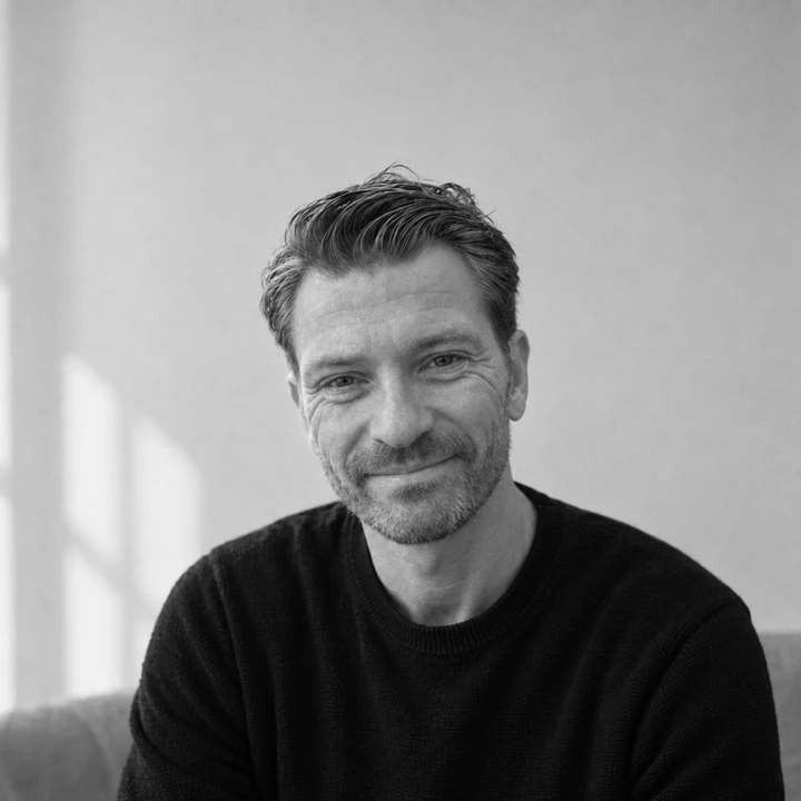 Jacob Top Møller smiling, in a black sweater